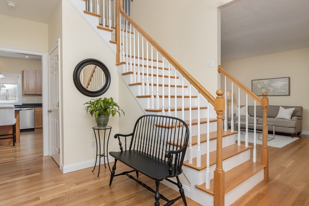 256 Lowell Road Groton, MA 01450 - Photo 6 of 40 a view of entryway livingroom and hall with wooden floor