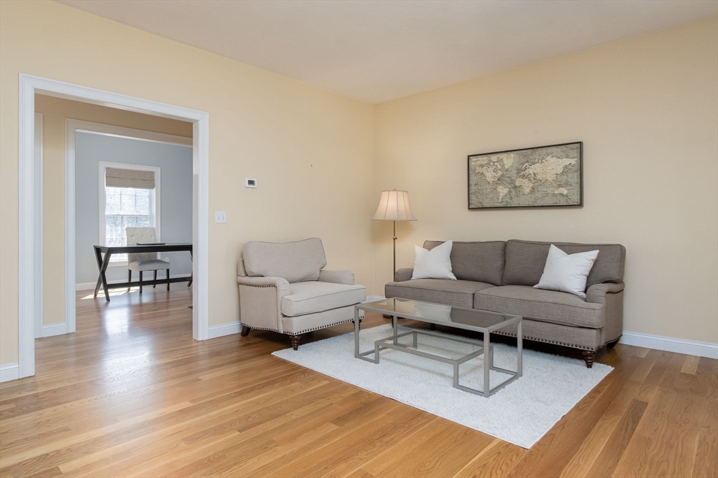 256 Lowell Road Groton, MA 01450 - Photo 7 of 40 a living room with furniture and a wooden floor