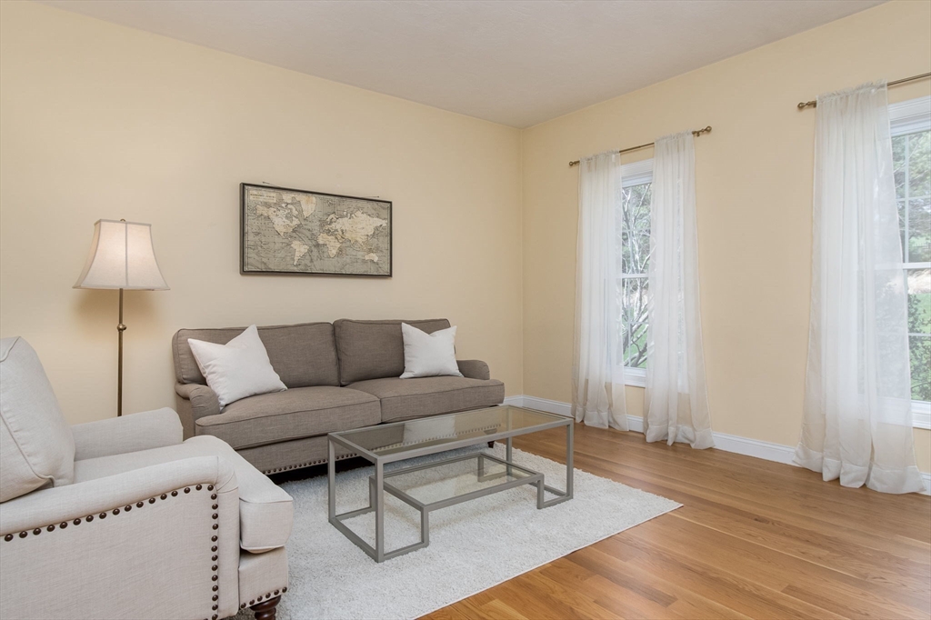 256 Lowell Road Groton, MA 01450 - Photo 8 of 40 a living room with furniture and a lamp