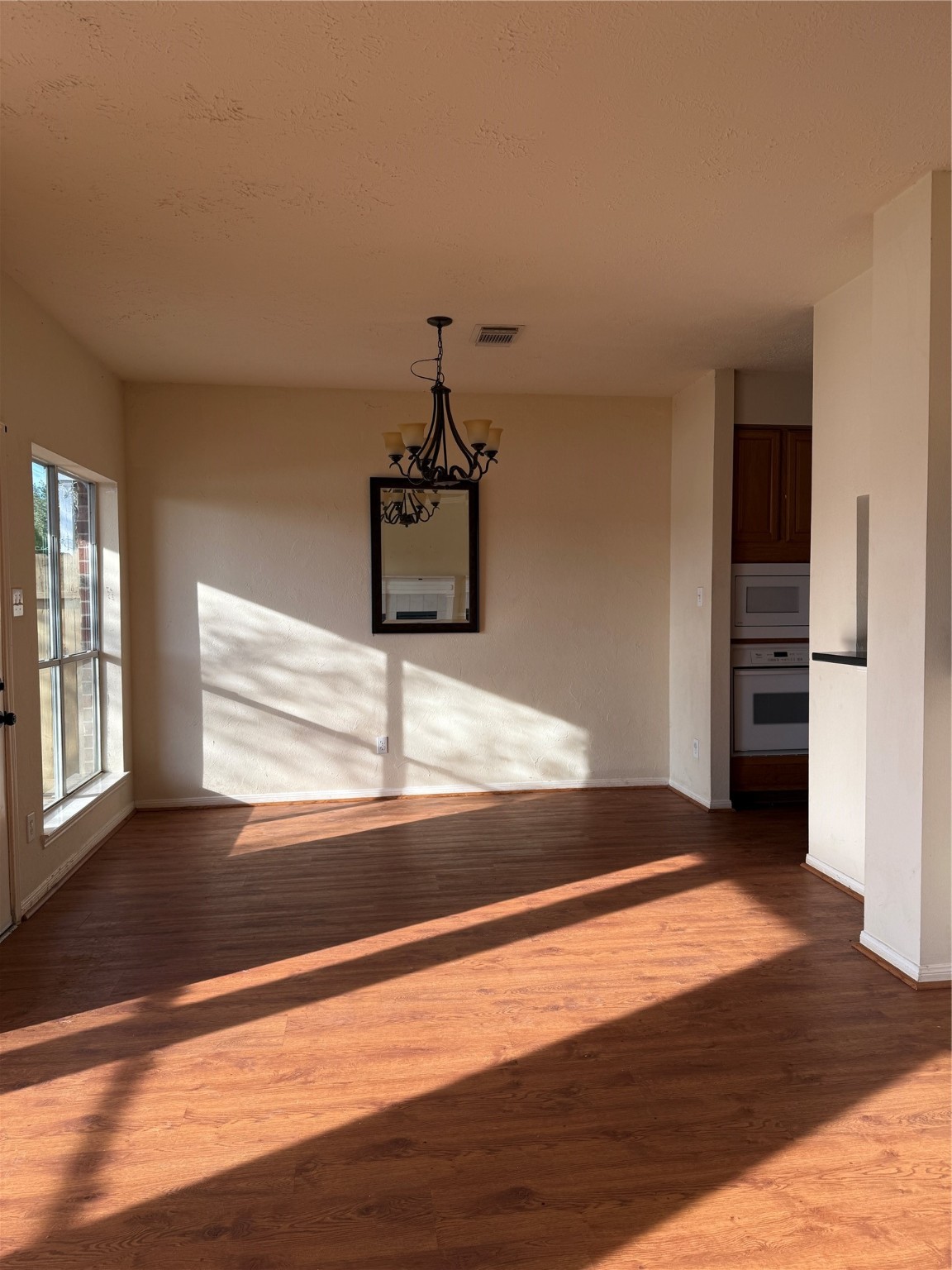 6714 Portuguese Bend Drive Missouri City, TX 77459 - Photo 3 of 13 a view of empty room with wooden floor