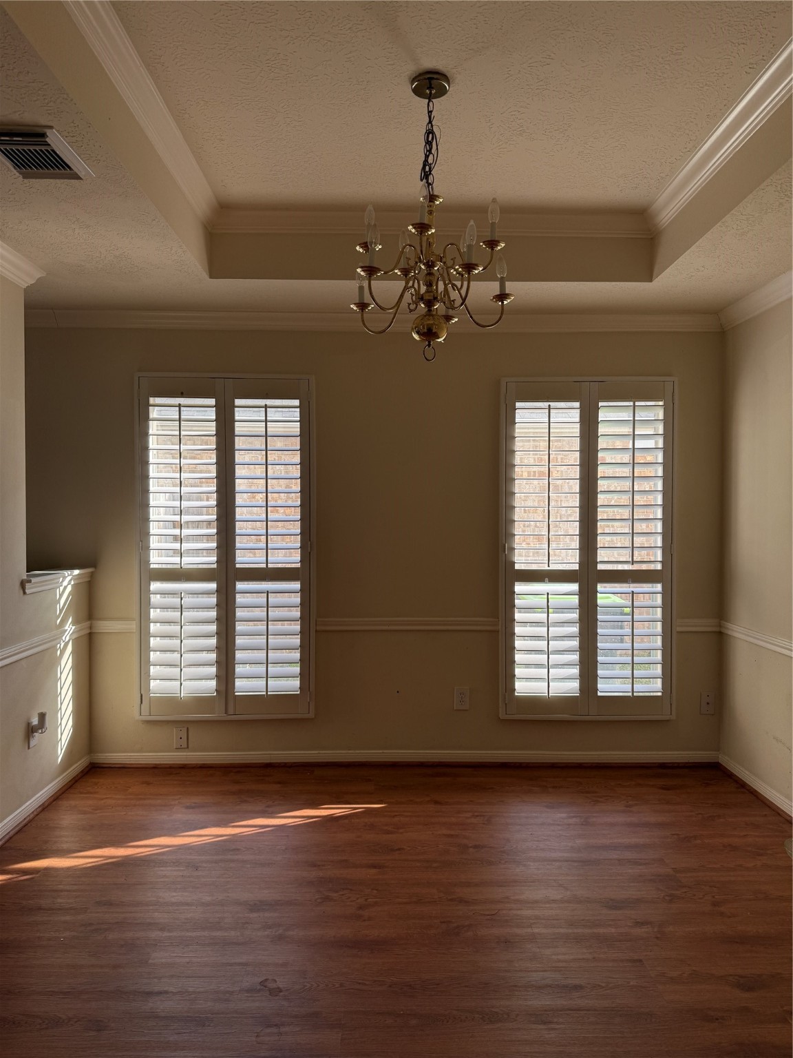 6714 Portuguese Bend Drive Missouri City, TX 77459 - Photo 5 of 13 a view of an empty room with a window and wooden floor