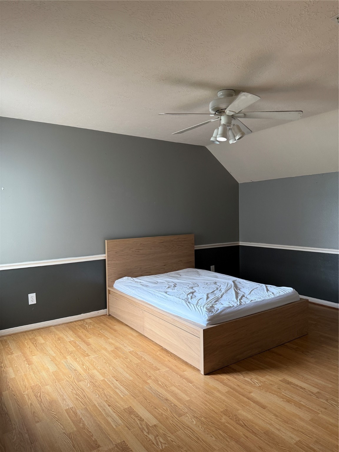 6714 Portuguese Bend Drive Missouri City, TX 77459 - Photo 9 of 13 a bedroom with a bed and a ceiling fan