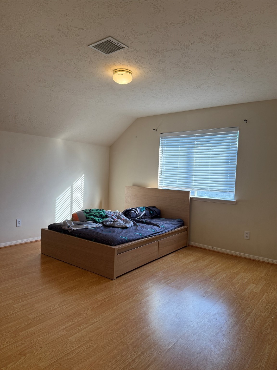 6714 Portuguese Bend Drive Missouri City, TX 77459 - Photo 10 of 13 a living room with hard wood floors and a couch