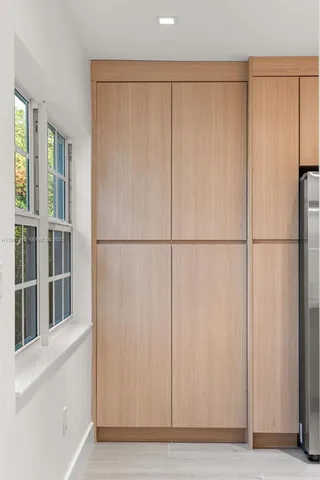 a bathroom with a glass shower door
