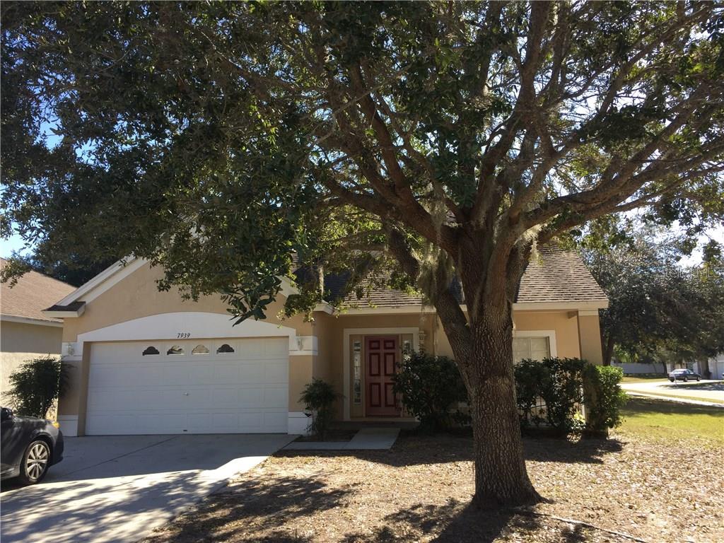 7939 Terrace Ridge Drive Temple Terrace, FL 33637 - Photo 1 of 1 a view of a house with a tree in front of it
