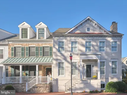 a front view of a residential apartment building with glass windows