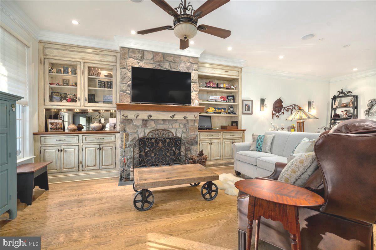 36 West Mechanic Street New Hope, PA 18938 - Photo 4 of 26 a living room with furniture a flat screen tv and kitchen view