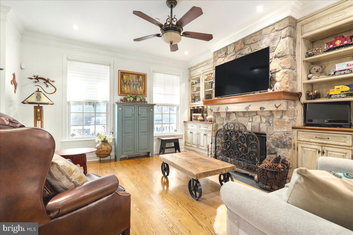 36 West Mechanic Street New Hope, PA 18938 - Photo 5 of 26 a living room with furniture a flat screen tv and a fireplace