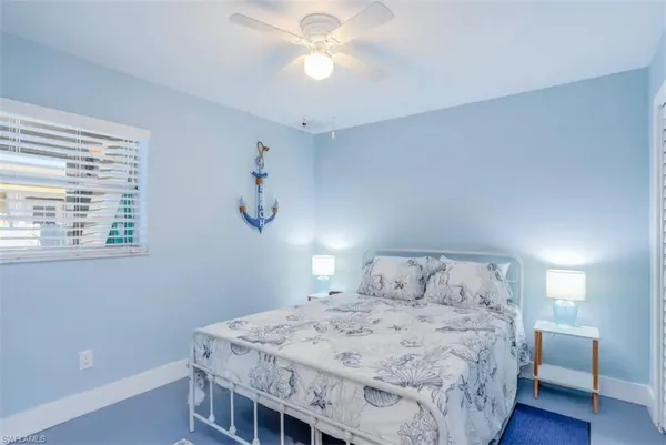 a bedroom with a bed and a table