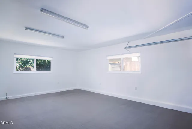 a front view of a house with garden and porch