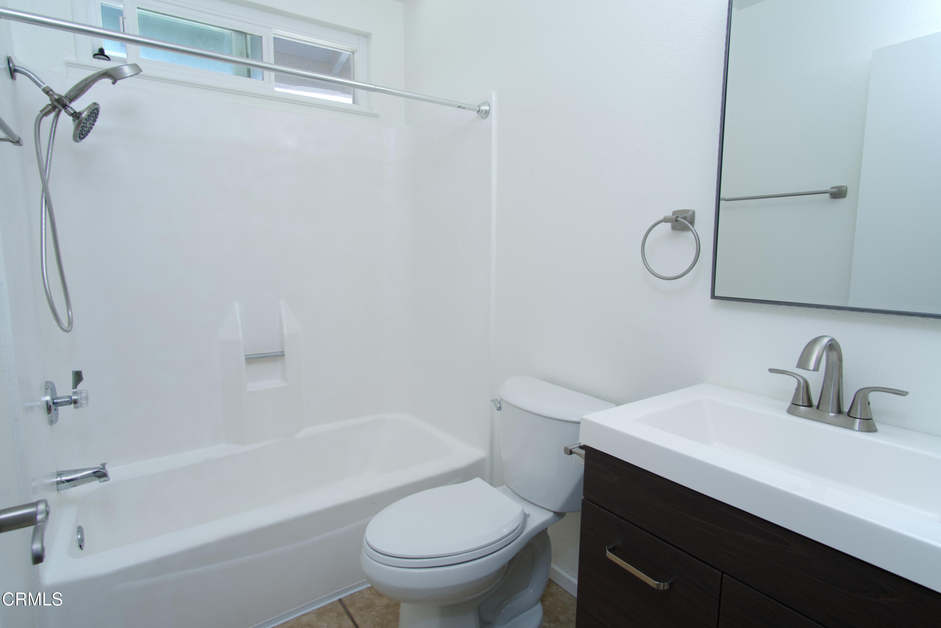 2121 Ironbark Drive Oxnard, CA 93036 - Photo 5 of 13 a bathroom with a sink toilet and shower
