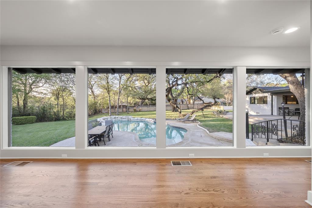 3400 MacArthur Drive Waco, TX 76708 - Photo 6 of 40 Wall of windows in Primary Bedroom with view of pool and mature trees