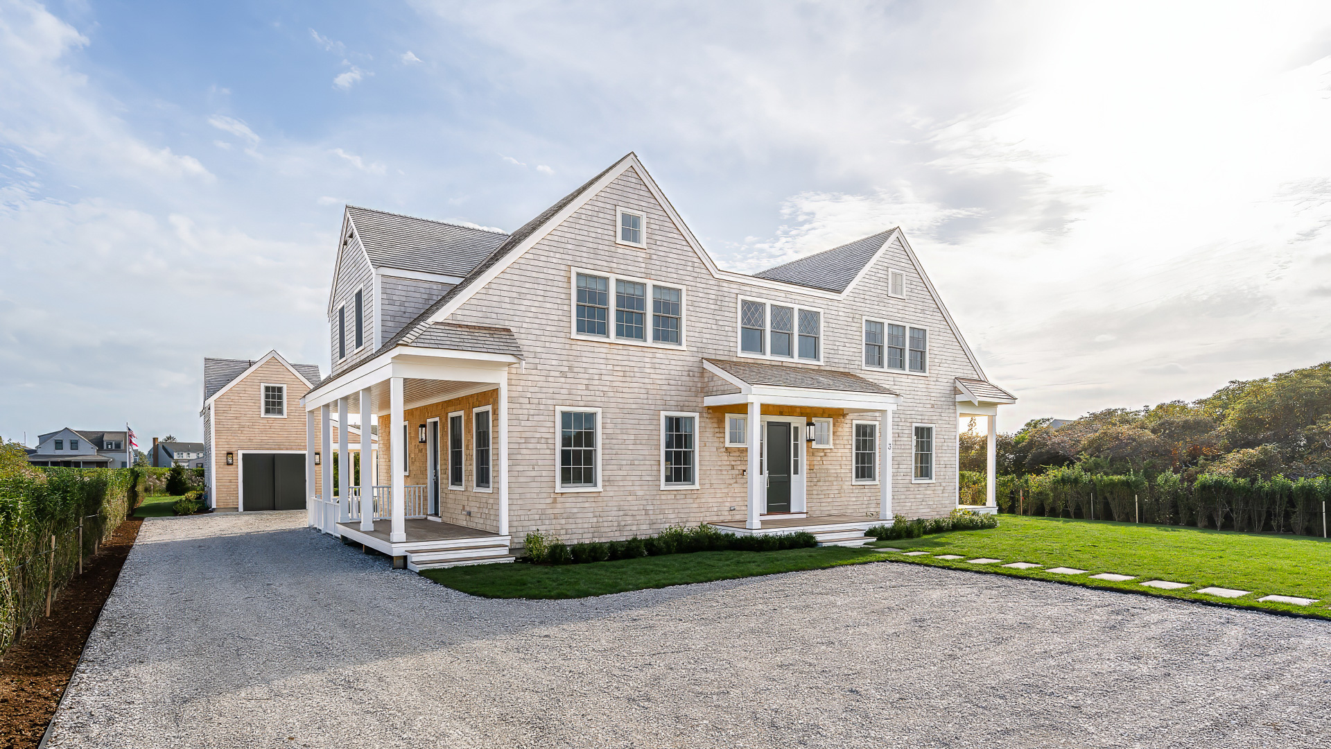 3 Westerwick Drive Nantucket, MA 02554 - Photo 2 of 49 a view of a white house next to a yard with big trees