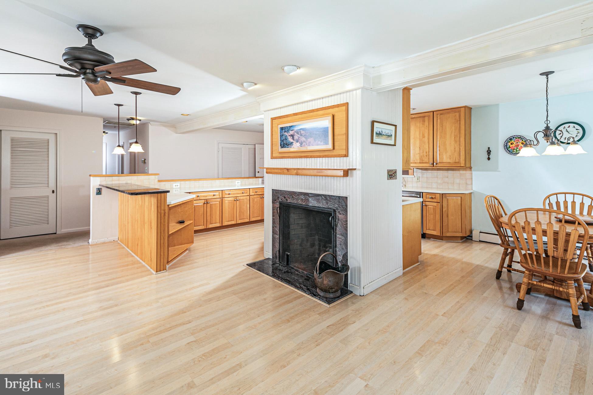 1146 Wrightstown Road Newtown, PA 18940 - Photo 13 of 35 Family room open to kitchen with fireplace