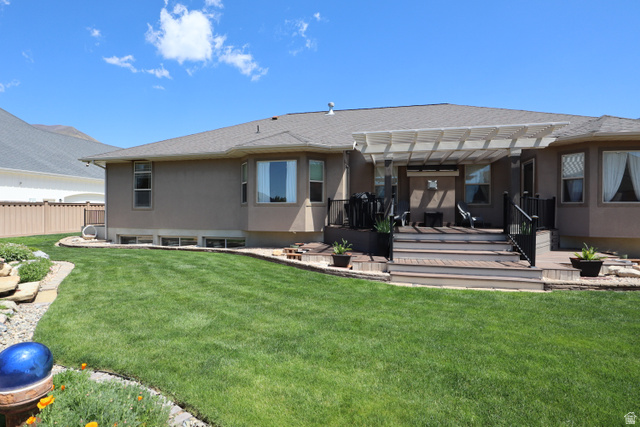 1055 North 1000 East Mapleton, UT 84664 - Photo 92 of 112 Expansive green lawn with a multi-level deck featuring a white pergola