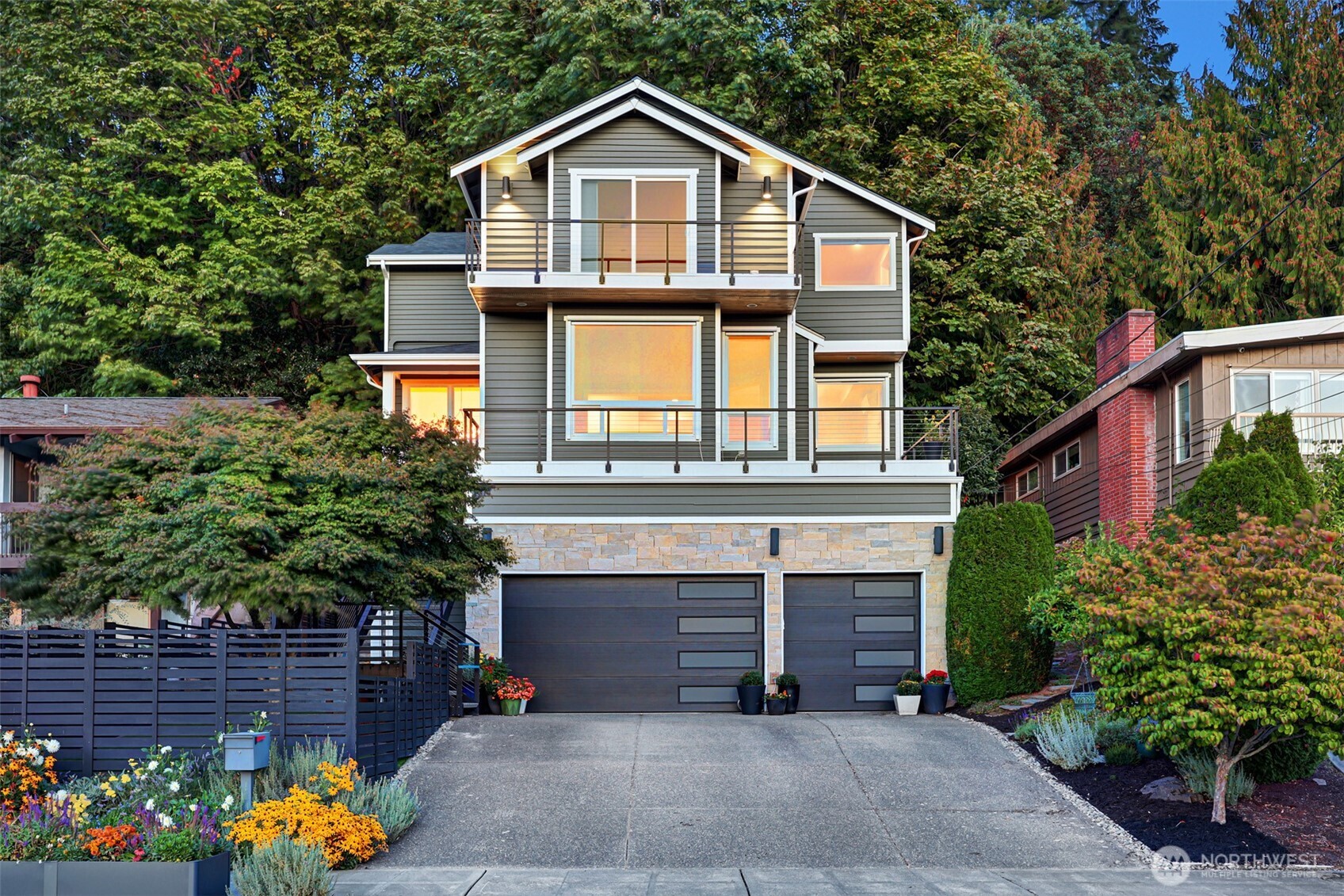a front view of a house with a yard and garage