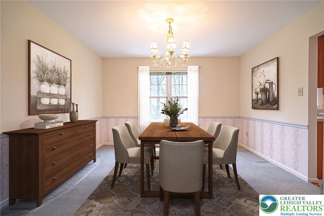 40 Elk Court Reading, PA 19606 - Photo 14 of 46 a dining room with furniture a chandelier and window