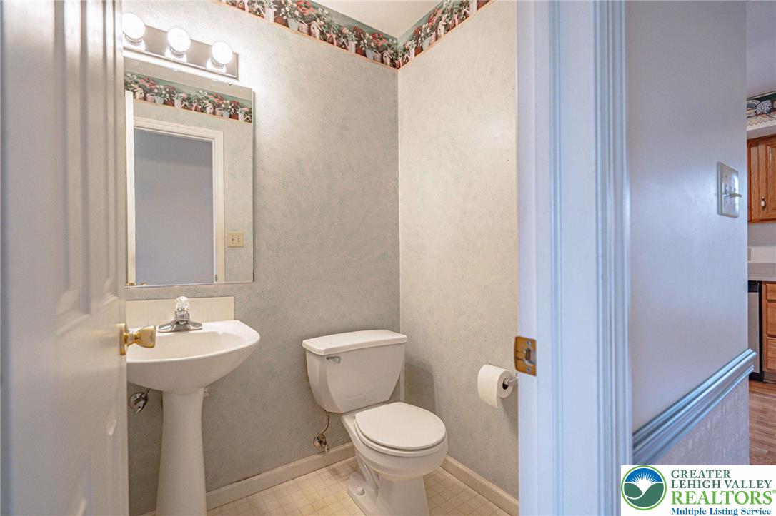 40 Elk Court Reading, PA 19606 - Photo 16 of 46 a bathroom with a toilet sink and mirror
