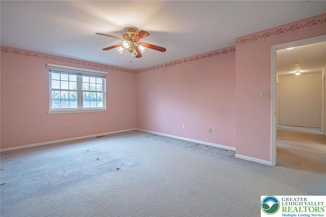 40 Elk Court Reading, PA 19606 - Photo 28 of 46 an empty room with a window and a fan