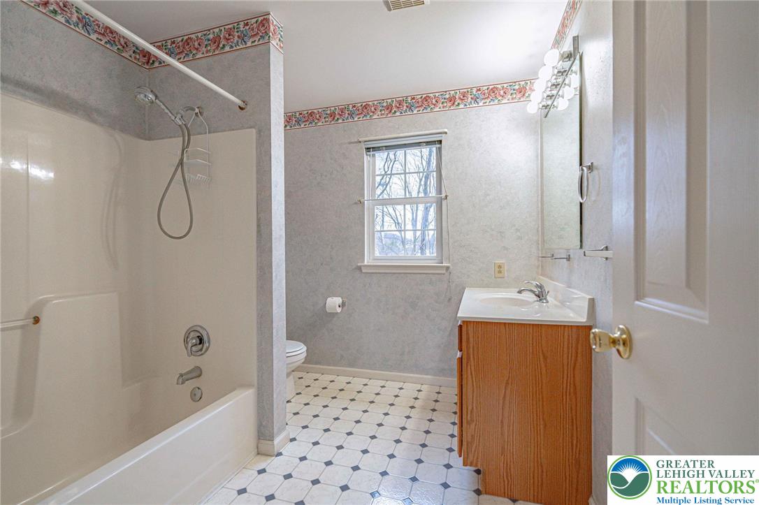40 Elk Court Reading, PA 19606 - Photo 31 of 46 a bathroom with a sink a toilet and shower