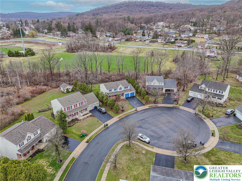 40 Elk Court Reading, PA 19606 - Photo 4 of 46 an aerial view of a house with garden space and outdoor seating