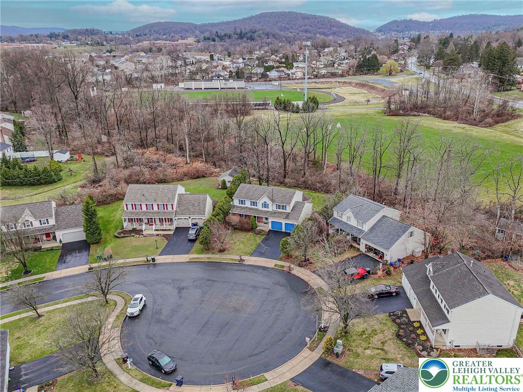 40 Elk Court Reading, PA 19606 - Photo 5 of 46 an aerial view of a house with a garden and lake view