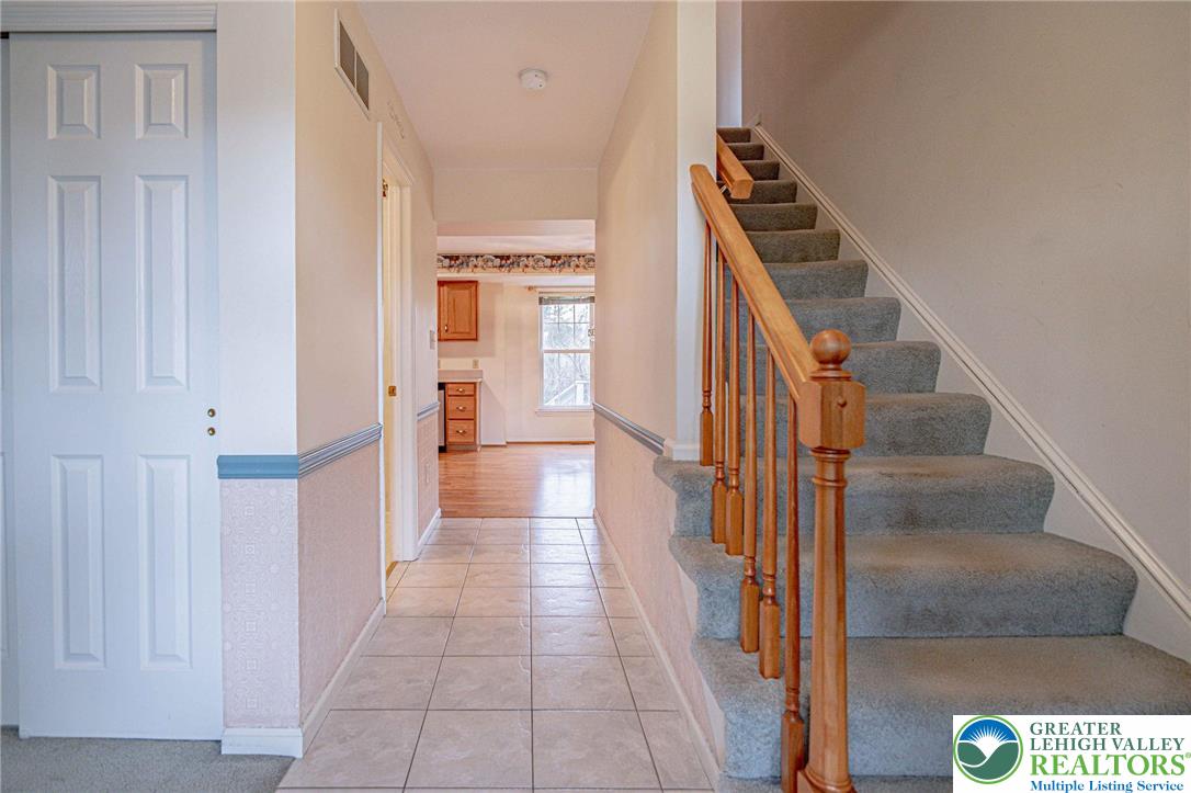 40 Elk Court Reading, PA 19606 - Photo 9 of 46 a view of a hallway with wooden floor and staircase