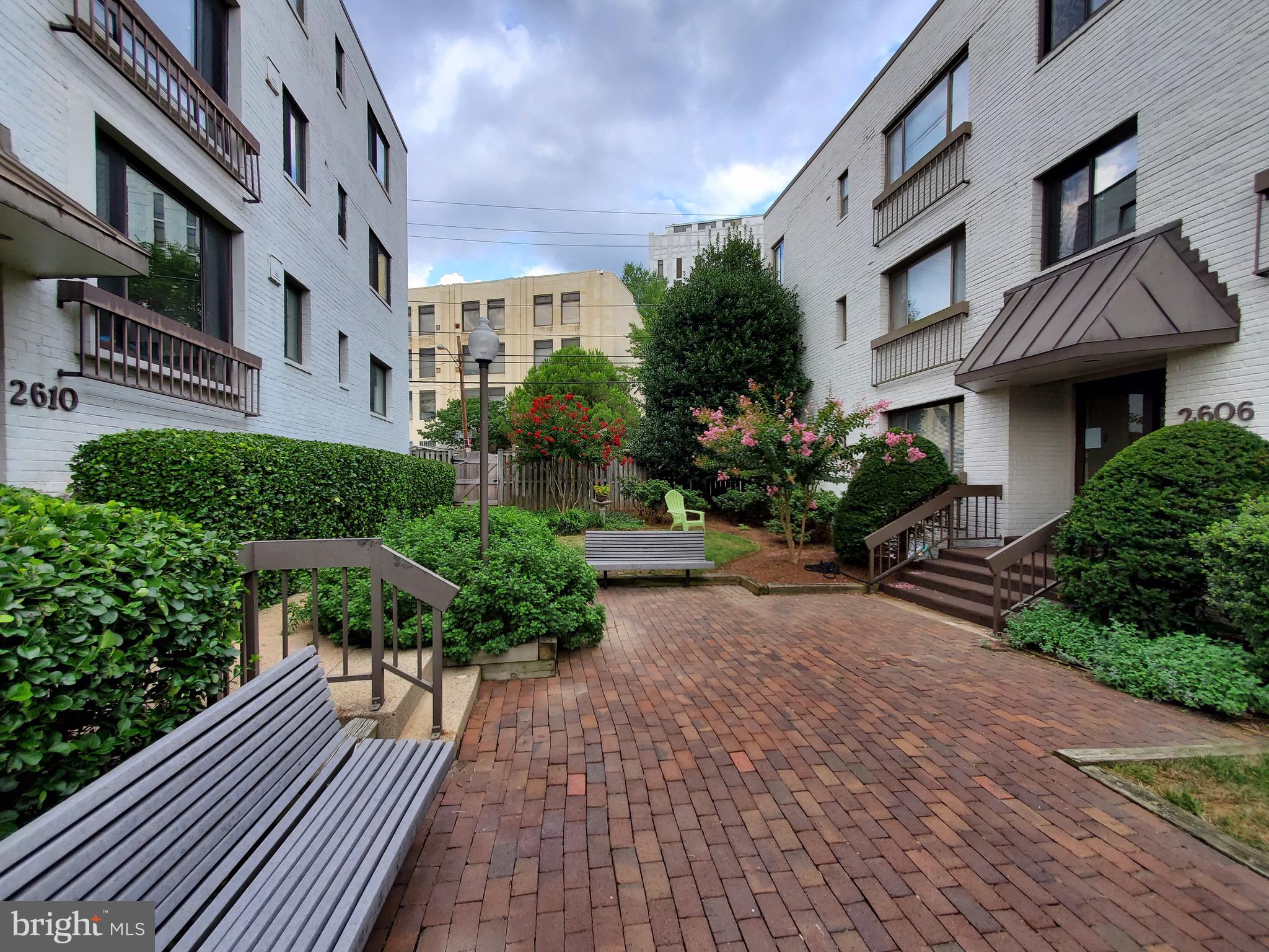 2610 Tunlaw Road Northwest, Unit 103 Washington, DC 20007 - Photo 3 of 36 a view of a pathway with a house