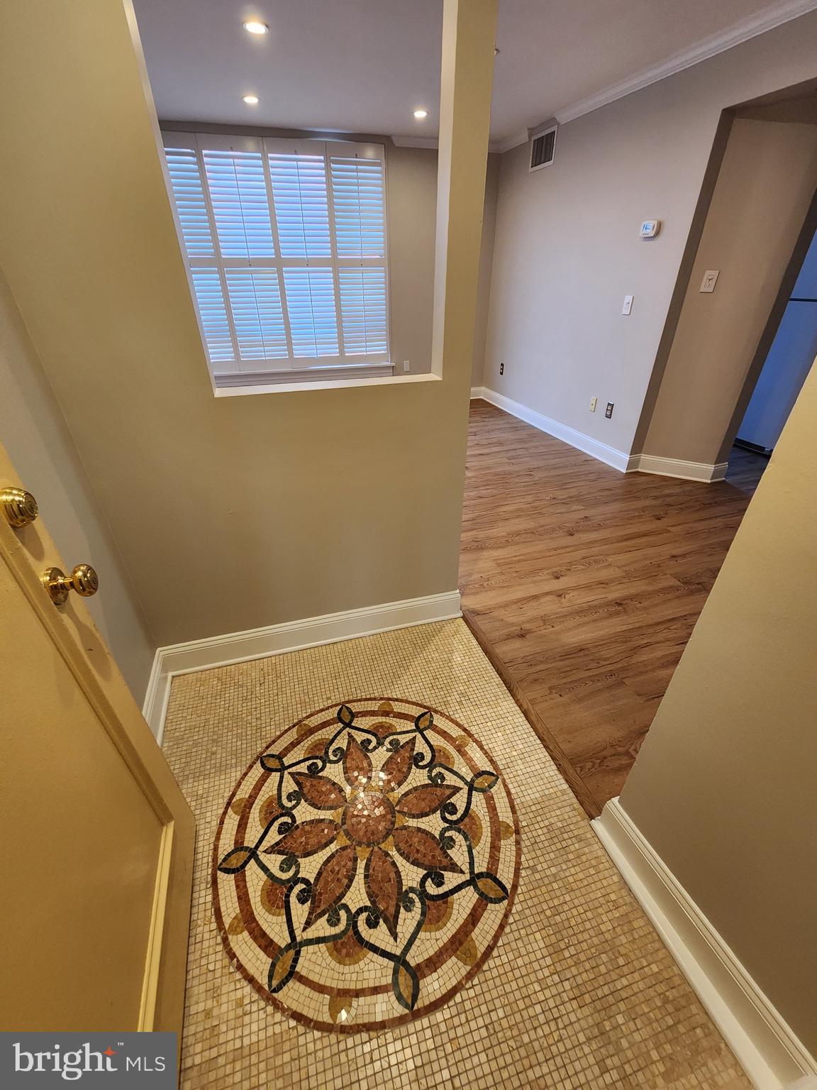 2610 Tunlaw Road Northwest, Unit 103 Washington, DC 20007 - Photo 5 of 36 a view of a hallway with wooden floor