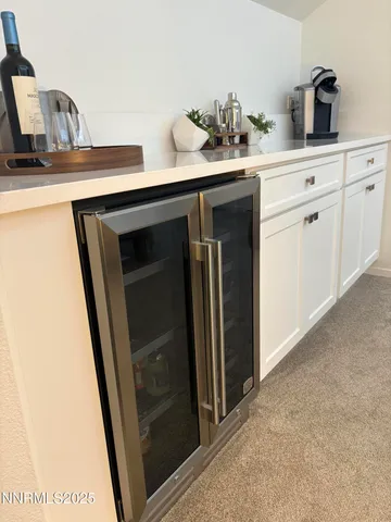 a view of a hallway with wooden floor and a bedroom