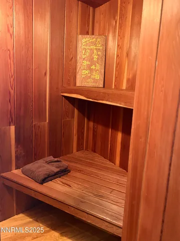 a room with gym equipment and view of living room