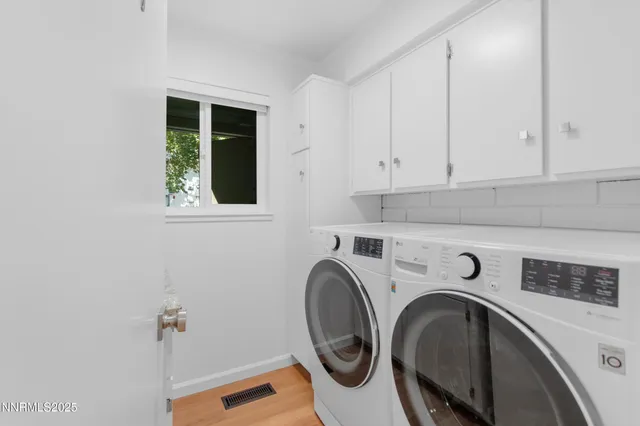 a kitchen with stainless steel appliances granite countertop a sink and cabinets