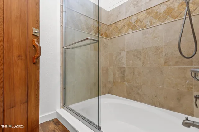 a kitchen with a sink stainless steel appliances and windows