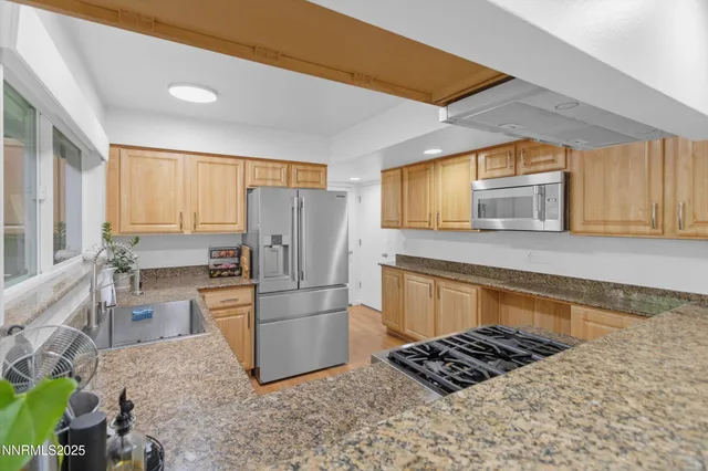 a building outdoor space with patio furniture and potted plants