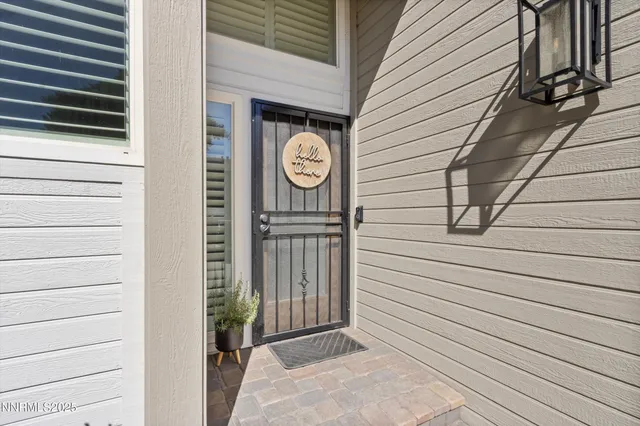 a view of a kitchen with a bench and a potted plant
