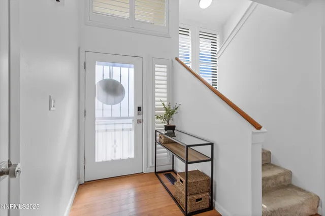 a open dining room with furniture and wooden floor