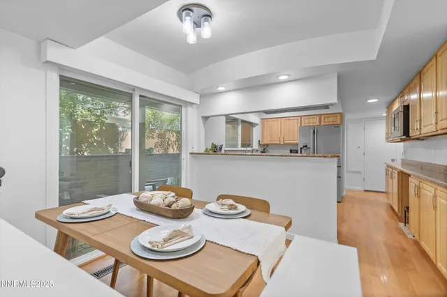 a living room with furniture window and wooden floor