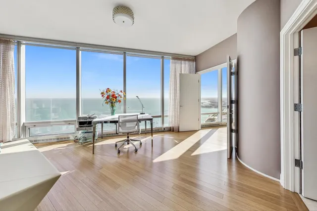 a view of a living room and a balcony