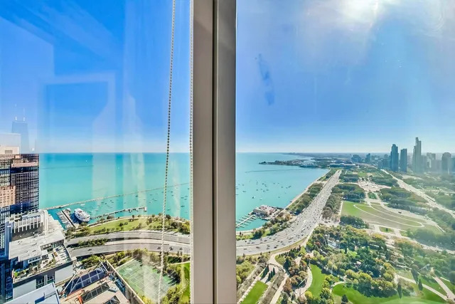 an aerial view of a house with a ocean view