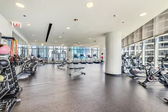 a room with lots of furniture and wooden floor