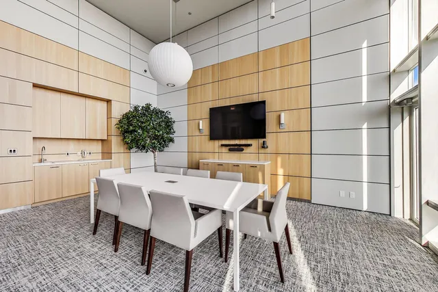 a kitchen with a table and chairs in it