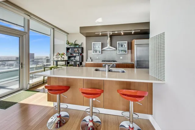 a kitchen with a dining table and chairs