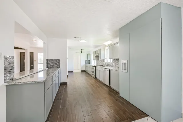 a kitchen with a stove and a microwave