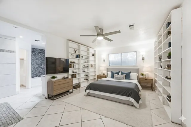 a view of a kitchen with a sink and an empty room