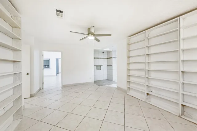 a bathroom with a granite countertop sink mirror and double