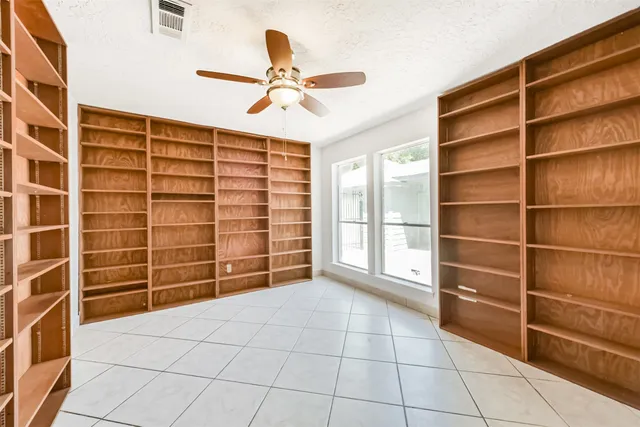 a view of a deck with table and chairs and wooden floor