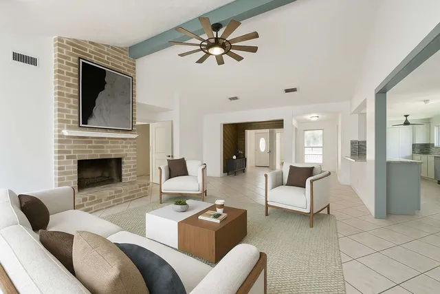 a view of an empty room with a fireplace