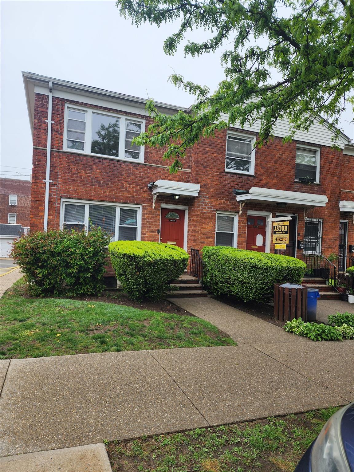 a front view of a building with garden