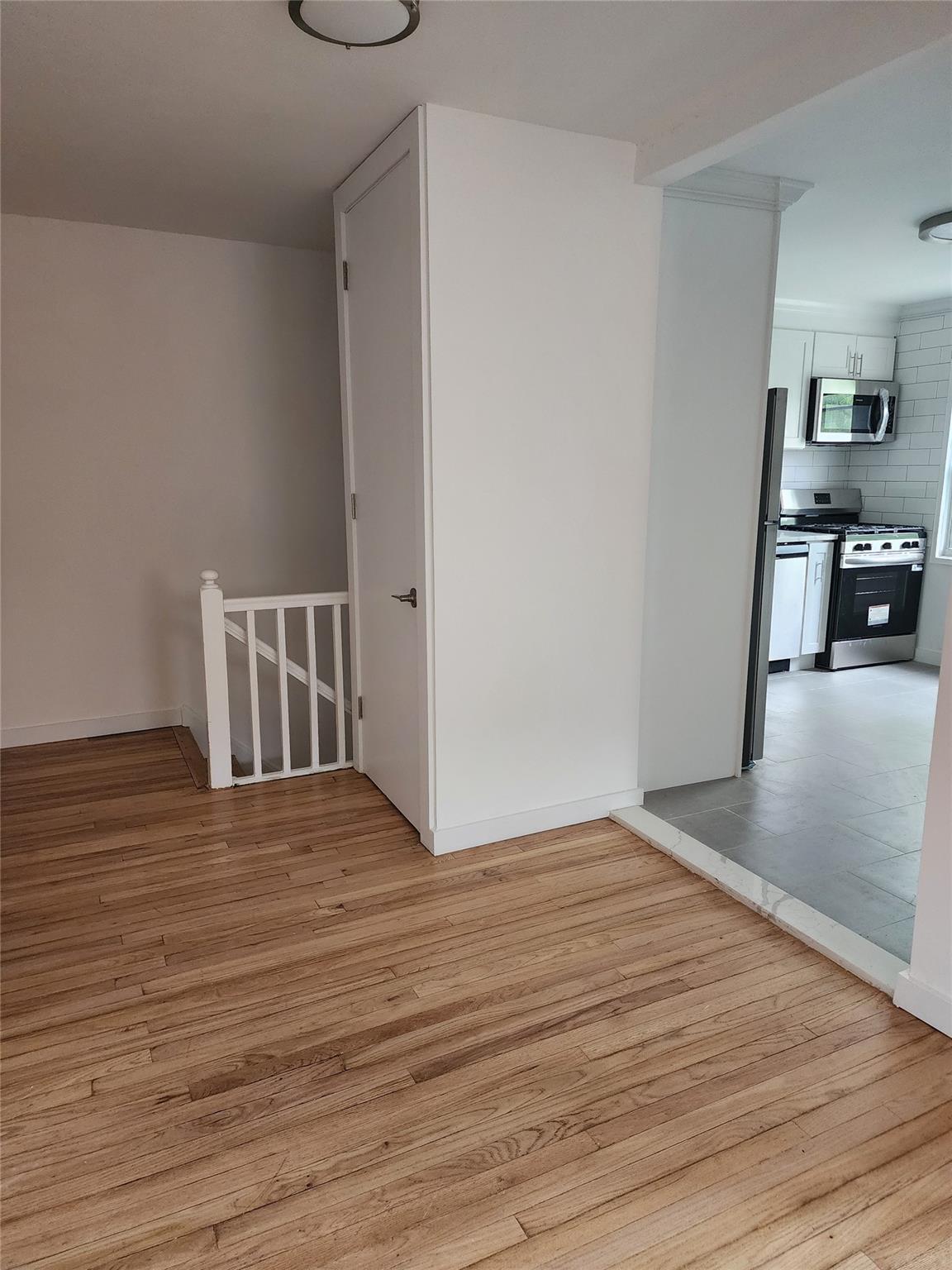 68-36 140th Street, Unit B Queens, NY 11367 - Photo 9 of 9 a view of empty room with wooden floor