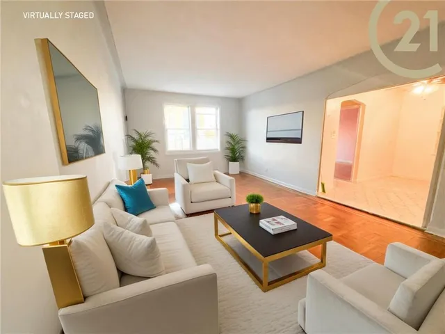 a living room with furniture and a lamp